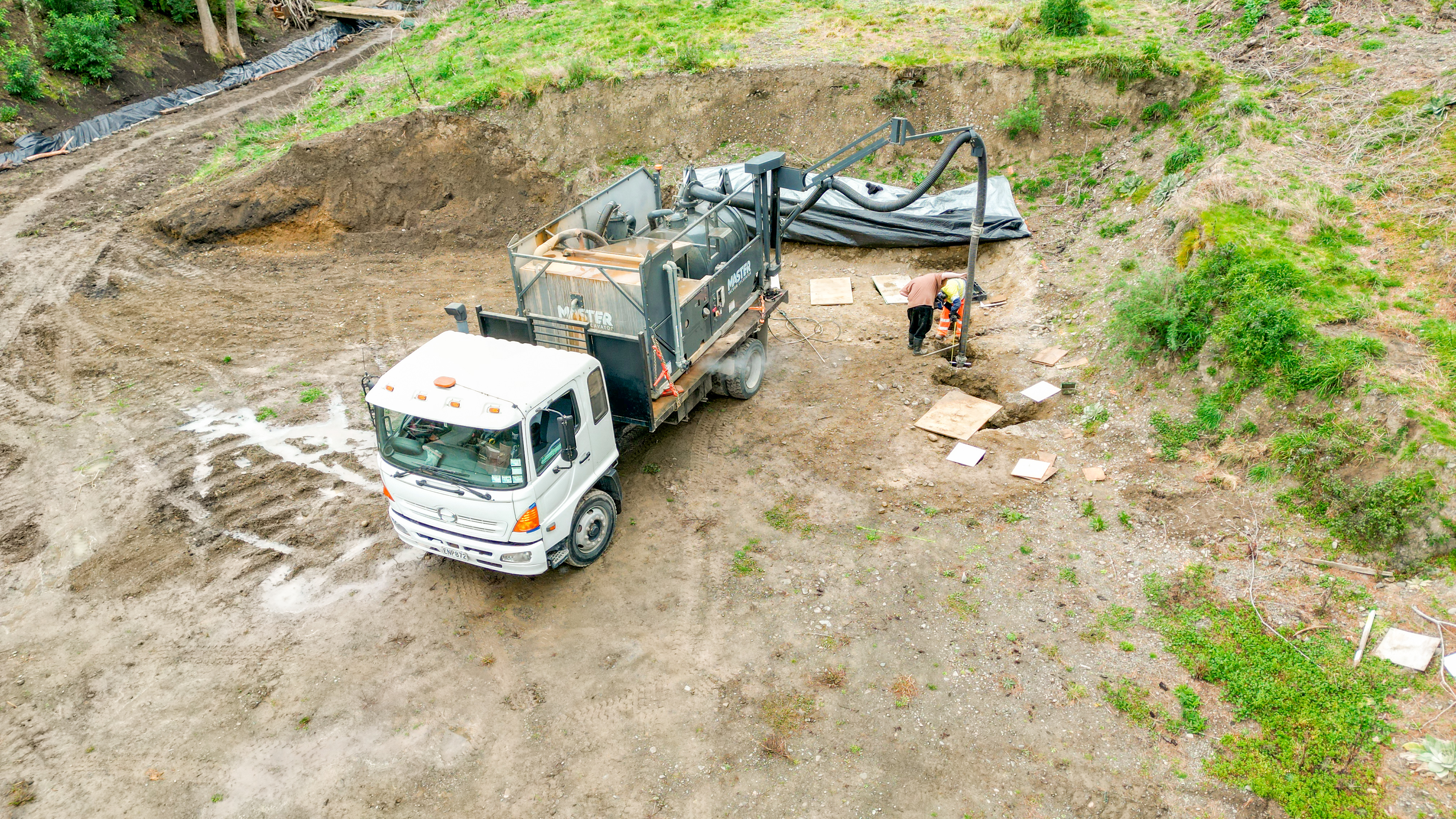 HydroMaster 2000 creating pile holes for a house foundation.