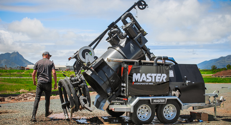 The AquaMaster 2000 cleaning out culverts under a railway line with a drain cleaning nozzle
